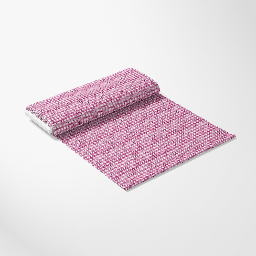 A roll of pink and white checkered fabric partially unrolled on a plain background.