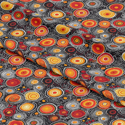 Aboriginal Circles and Dots Pattern 12 Quilting Cotton Fabric featuring vibrant red, orange, yellow, black, and white colors, circular motifs, dot accents, traditional design, textile, quilting cotton, fabric yardage.