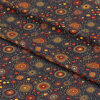 Aboriginal Circles and Dots Pattern 6 Quilting Cotton Fabric with black background, red, orange, and yellow circular motifs, dot clusters, traditional design, textile, cotton material, quilting cloth, vibrant colors, craft fabric, decorative print, artistic pattern, sewing fabric, handmade projects, fabric yardage.