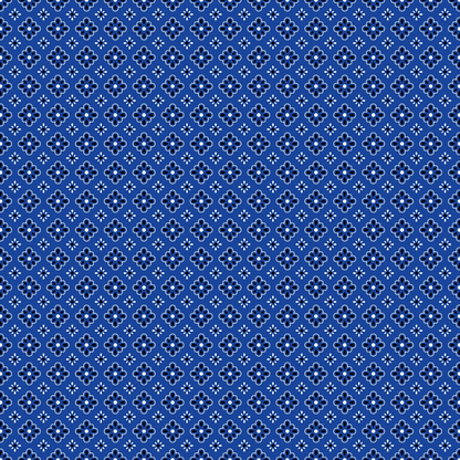 Blue geometric pattern with small white symmetrical shapes, arranged in a grid, covering the entire image.