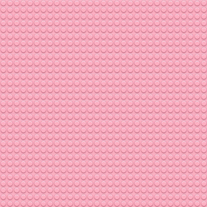 Pink rubber mat with a circular pattern of small raised dots evenly distributed across the surface.