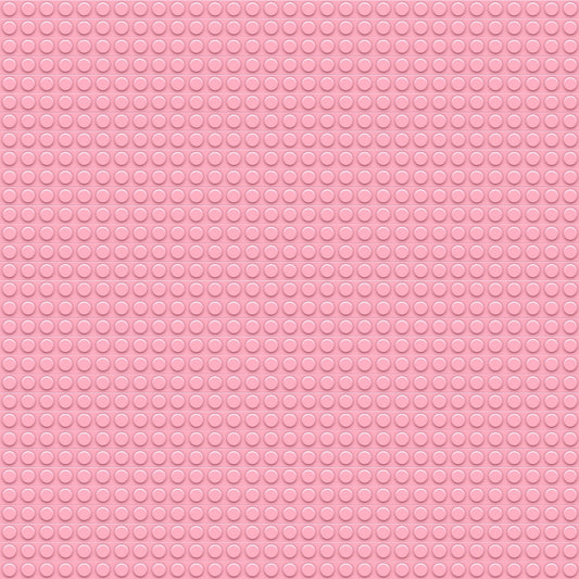 Pink rubber mat with a circular pattern of small raised dots evenly distributed across the surface.