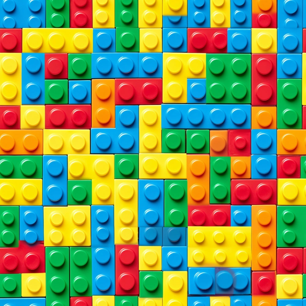 A colorful pattern of interlocking toy bricks in red, blue, yellow, and green arranged in a grid-like formation.