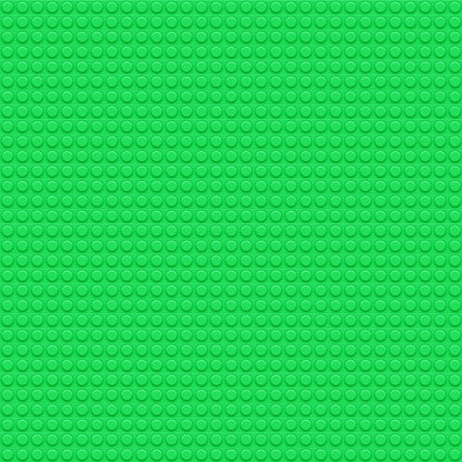 A green textured surface with a pattern of circular bumps, resembling a LEGO base plate.