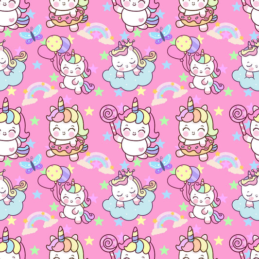 Pattern of cute unicorns, rainbows, stars, and clouds with balloons and lollipops on a pink background.