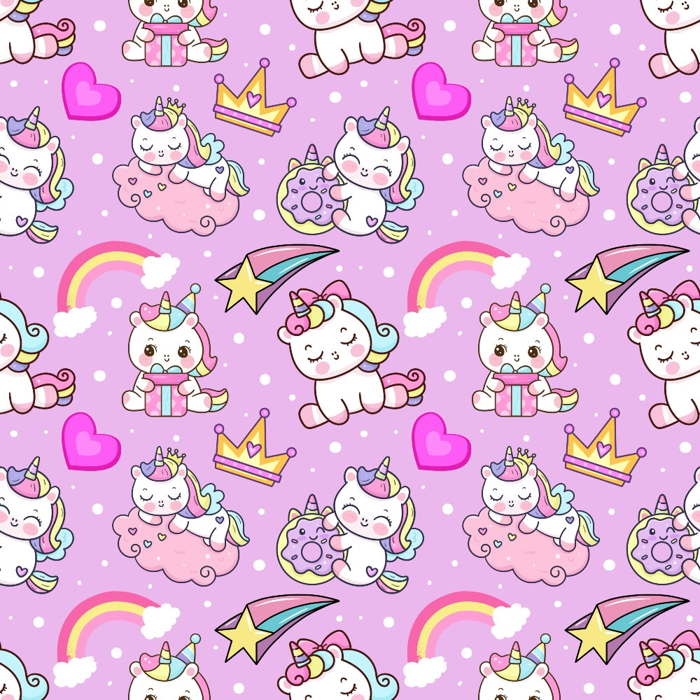 Pattern of cartoon unicorns, crowns, rainbows, hearts, shooting stars, and donuts on a pink background with polka dots.