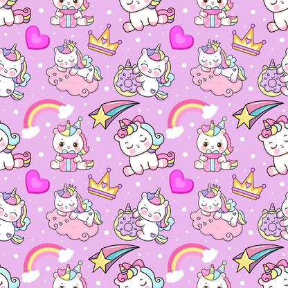 Pattern of cartoon unicorns, crowns, rainbows, hearts, shooting stars, and donuts on a pink background with polka dots.