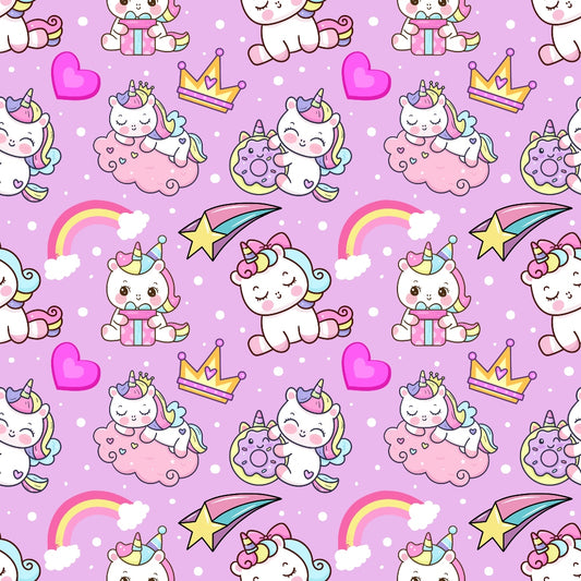 Pattern of cartoon unicorns, crowns, rainbows, hearts, shooting stars, and donuts on a pink background with polka dots.