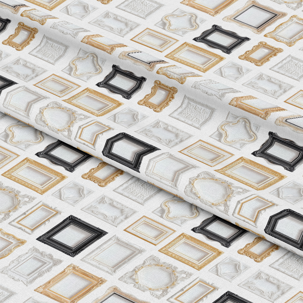 A fabric patterned with various empty picture frames in black, gold, and white on a white background, folded to show texture.