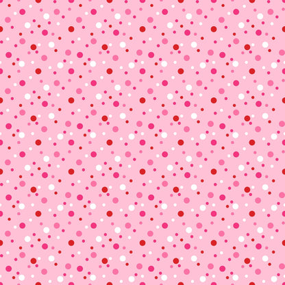 Pink background with a pattern of red and white polka dots in varying sizes.