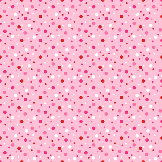 Pink background with a pattern of red and white polka dots in varying sizes.