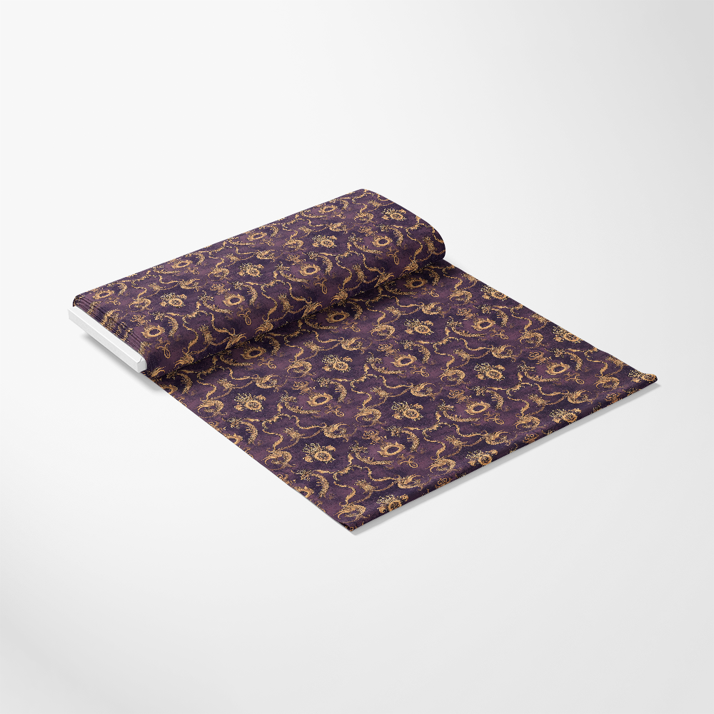 A roll of purple fabric with a gold floral pattern, partially unrolled on a white background.