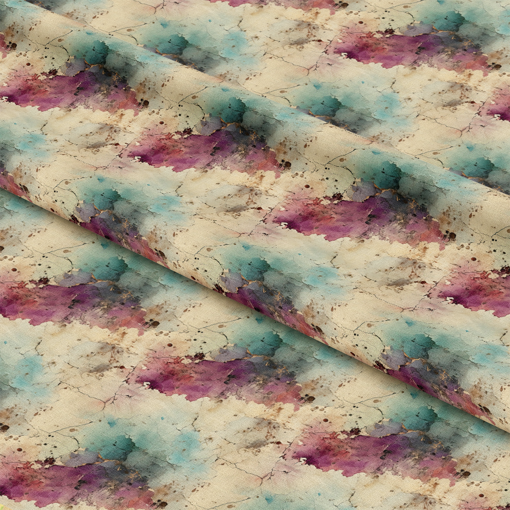 A close-up view of fabric featuring a repeating abstract watercolor pattern in shades of purple, blue, and beige with scattered brown speckles. The fabric is displayed with slight folds.