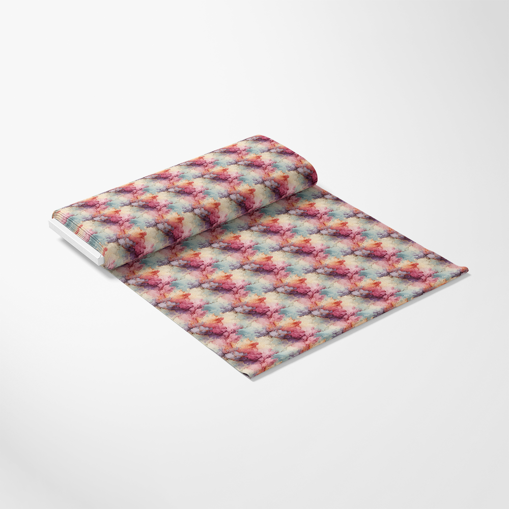 A partially unrolled sheet of wrapping paper with a colorful, abstract pattern featuring red, blue, yellow, and purple tones, displayed on a white surface.
