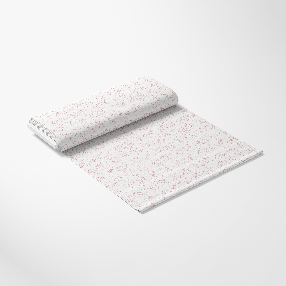 A roll of white wrapping paper with a subtle red floral pattern, partially unrolled on a plain white surface.