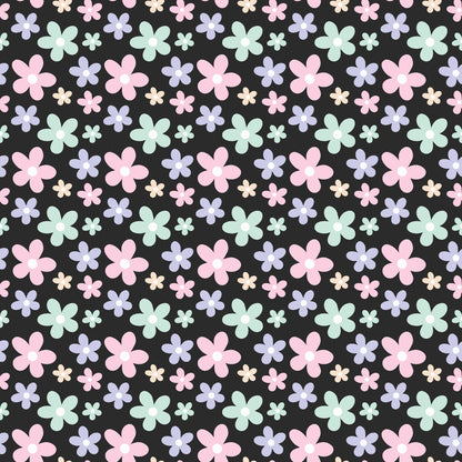 Pattern of pastel-colored flowers in pink, blue, and green on a black background. Various sizes are evenly distributed across the image.