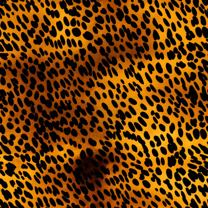 Leopard print pattern with irregular black spots on a golden brown background.