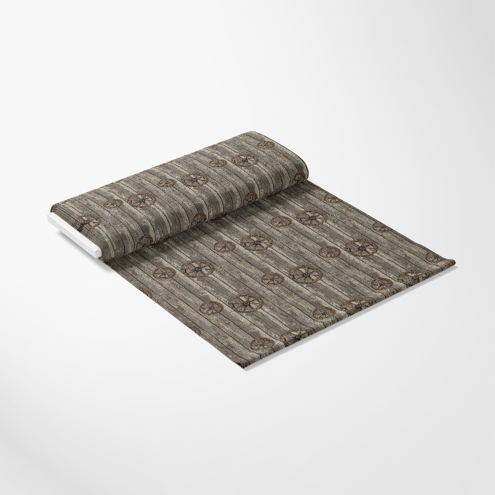 A roll of wallpaper with a brown, patterned design featuring circular motifs on a wooden texture background, partially unrolled on a white surface.