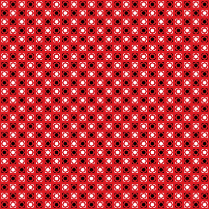 Pattern of small red and black squares with clover-shaped white elements, repeated across the image.