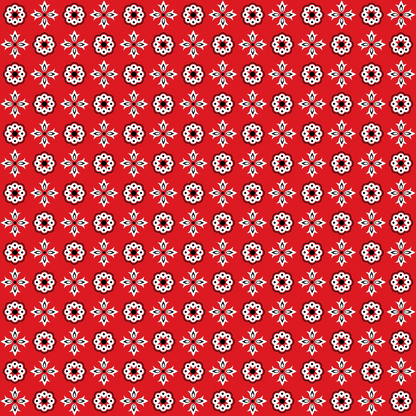 Red background with a repeating pattern of small white and black floral motifs arranged in rows.