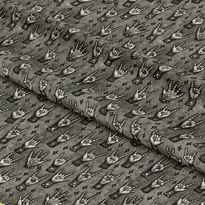A patterned fabric featuring repeated illustrations of hands making various gestures, such as peace signs, pointing, and the rock on symbol, with some hands decorated with rings or tattoos on a gray background.