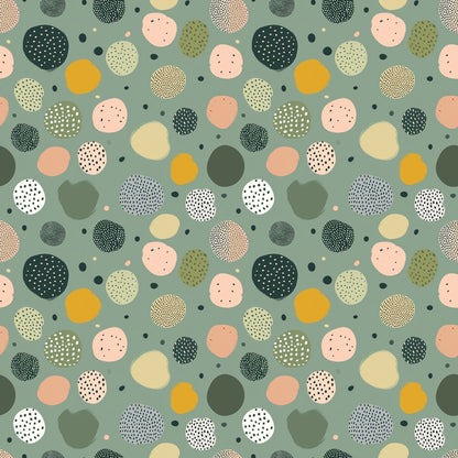 Abstract pattern of variously colored and textured circles on a green background.