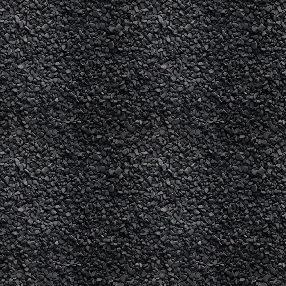 Dark gray gravel stones uniformly spread across the image, creating a textured, rocky surface.