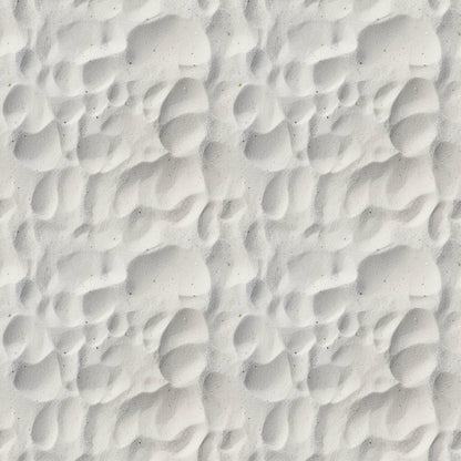 Close-up of white sand with rippled patterns and shadows.