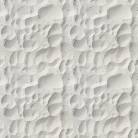 Close-up of white sand with rippled patterns and shadows.