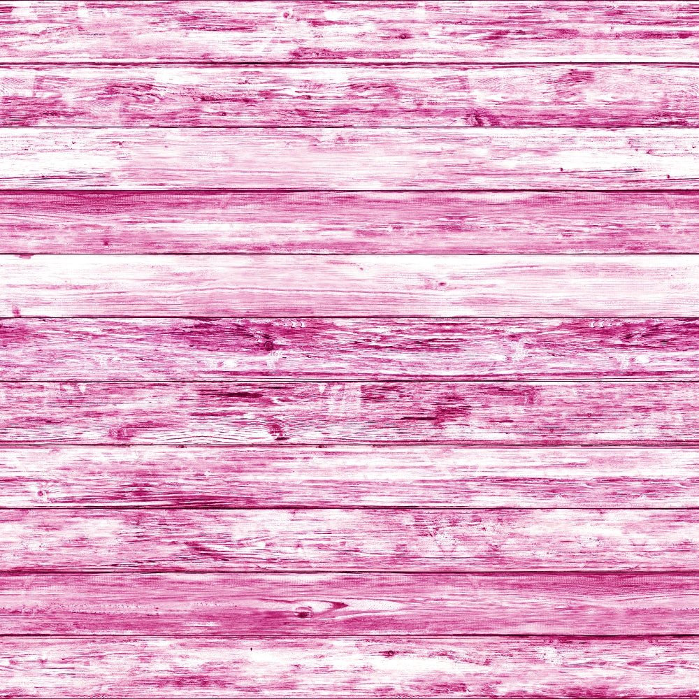 A textured wooden surface painted in shades of pink with visible grain and plank separations.