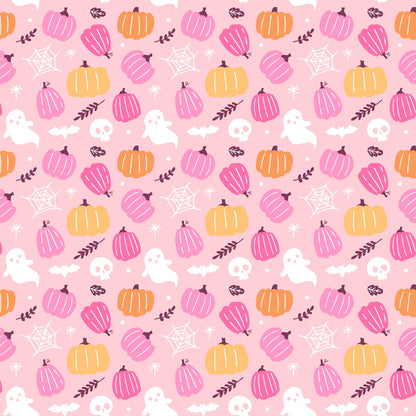 Halloween-themed pattern featuring pink background with orange and pink pumpkins, white ghosts, skulls, bats, leaves, and spider webs.