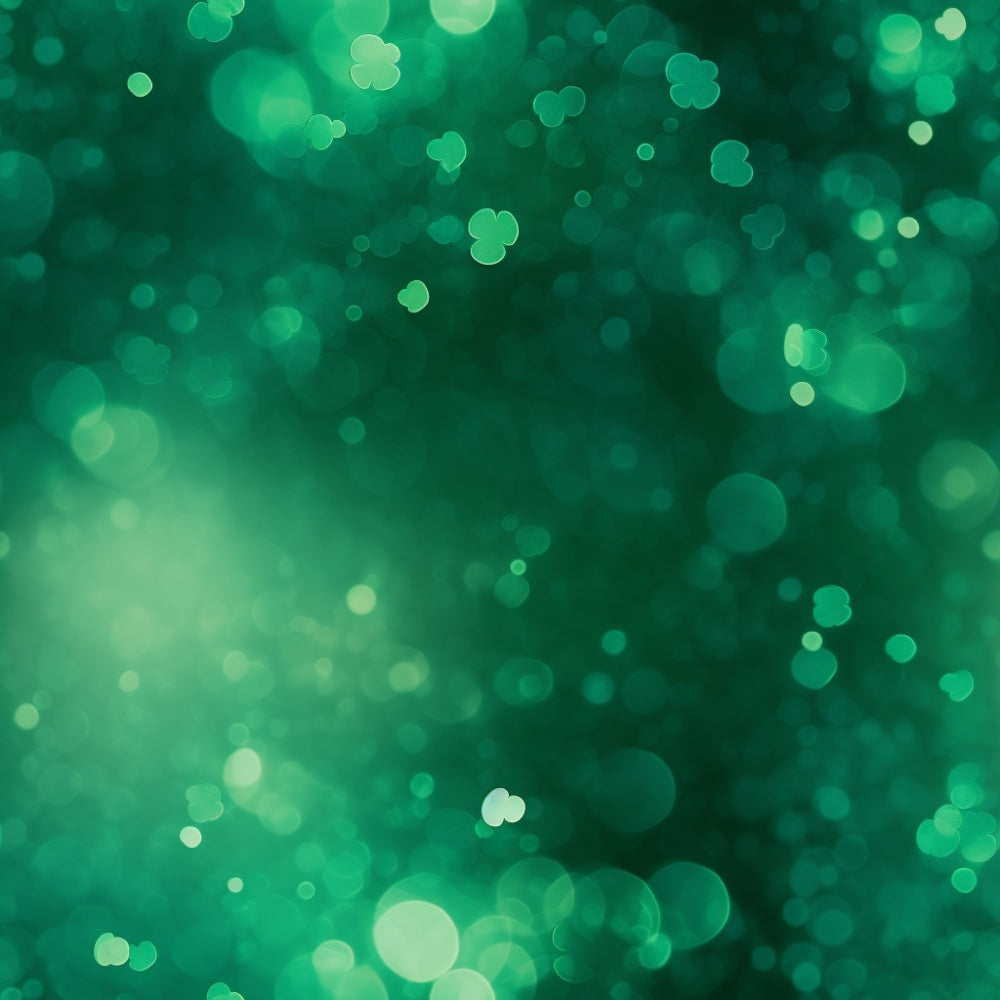 A green bokeh background with variously sized blurry circles and small clover shapes scattered throughout.