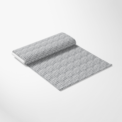 A roll of light gray grid-patterned wallpaper partially unrolled on a white background.