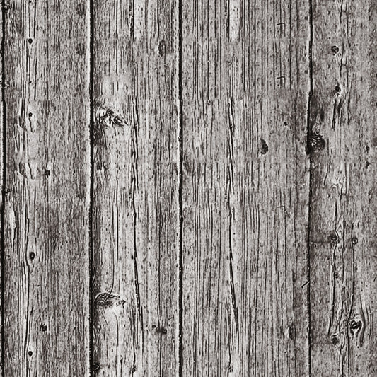 Close-up view of a weathered wooden surface with vertical planks, showing grain patterns and knots. The texture is rough and aged.