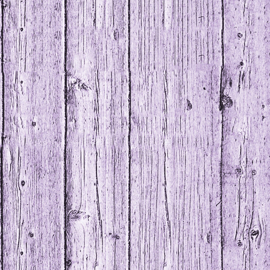 Close-up of a weathered wooden plank wall, painted in a faded lavender color, showing grain and knots.