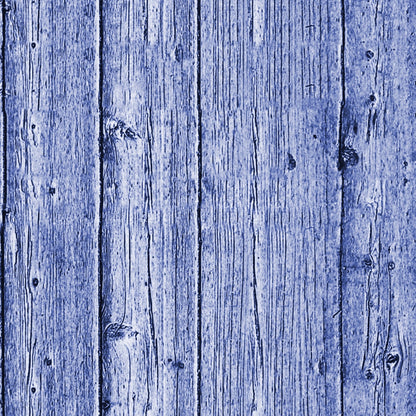 Wooden planks with a blue tint, showing vertical alignment and visible knots and grain patterns.