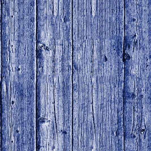 Close-up of vertical wooden planks with a blue tint, showing natural grain and texture.