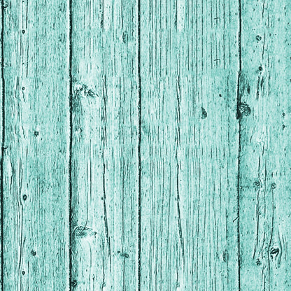 A wooden surface with a turquoise paint finish and visible grain patterns.