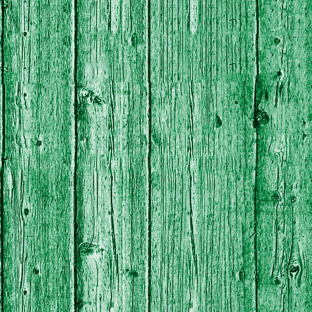 Close-up of a green wooden wall with vertical planks showing natural wood grain and knots.