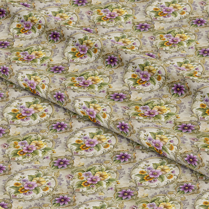 A close-up of fabric featuring a repeating floral pattern with purple, yellow, and orange flowers inside ornate oval frames on a light, textured background. The fabric is gently folded, creating visible creases.