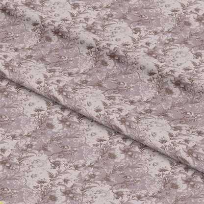 Close-up of light purple fabric with an intricate, repeating floral and leafy vine pattern in a slightly darker shade. The fabric is shown folded, highlighting its texture and print details.