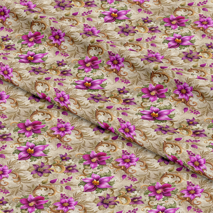 A close-up of beige fabric decorated with a repeating pattern of purple and pink flowers, green leaves, and swirling gold vines. The fabric is folded, showing the floral design from different angles.