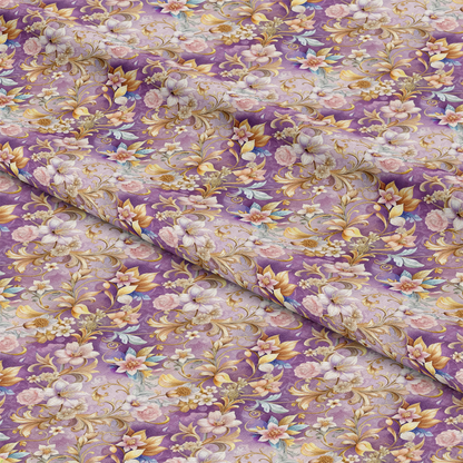 A piece of purple fabric with a detailed floral pattern featuring pink, white, and blue flowers, green leaves, and gold swirling vines. The fabric appears slightly folded.
