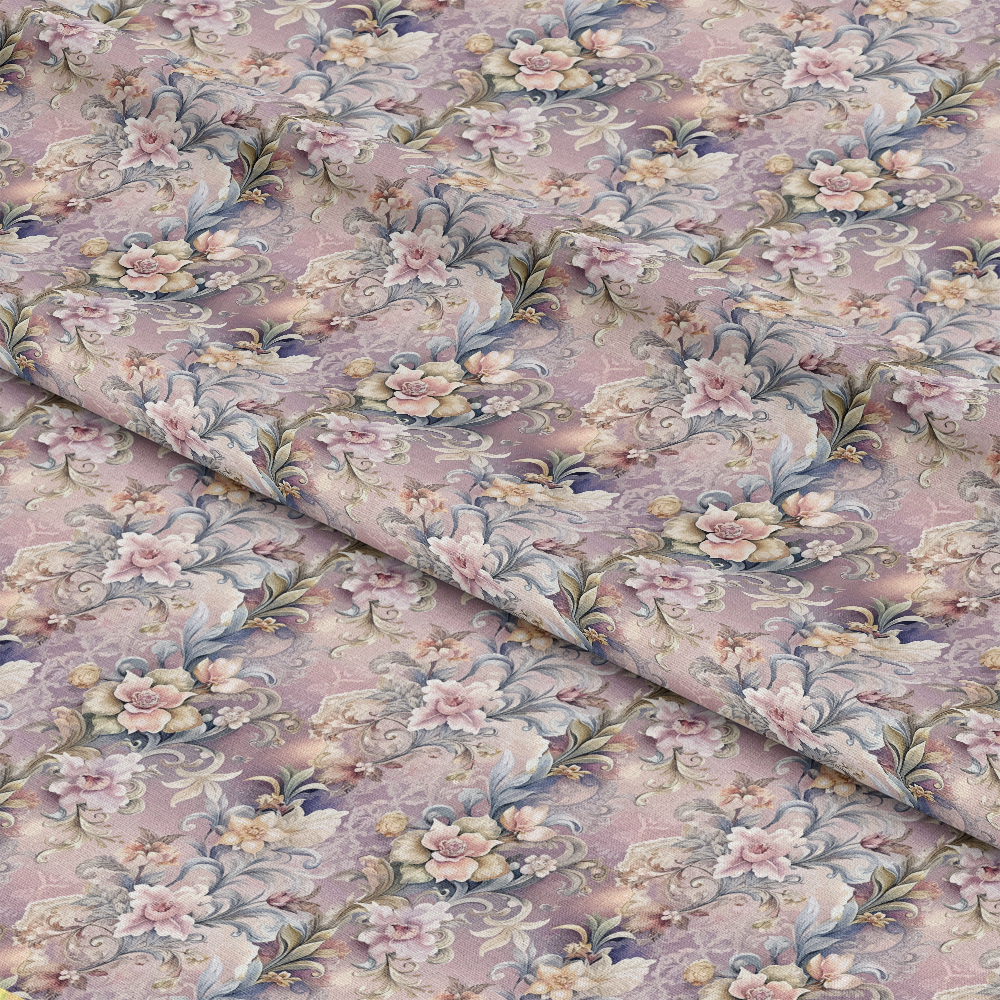 A close-up view of folded fabric with a detailed floral pattern featuring pink, purple, and light blue flowers and green leaves on a muted lavender background. The fabric has a vintage, ornamental style.