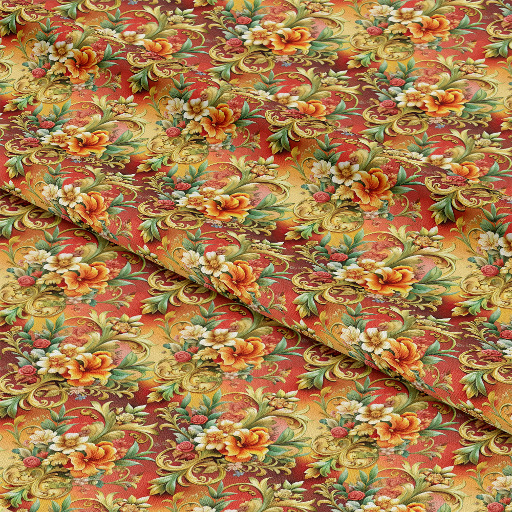 A close-up view of fabric with a repeating floral and leaf pattern in shades of orange, green, and gold on a mottled red and yellow background. The fabric is slightly folded, showing texture and depth.