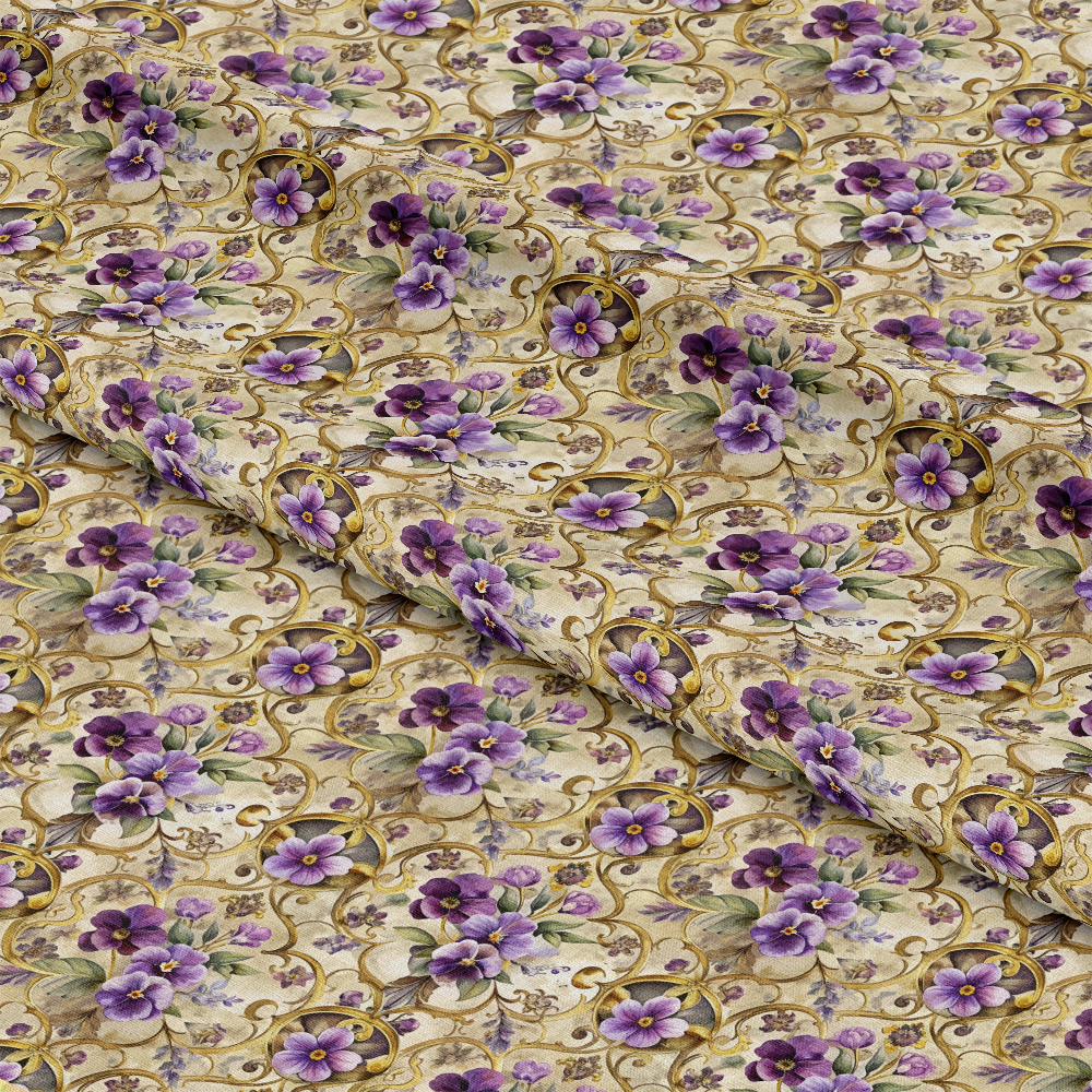 A piece of fabric with a repeating pattern of purple flowers and green leaves on a beige background with ornate gold vines, shown slightly folded to reveal texture and print consistency.