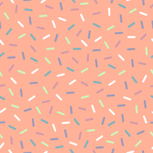 coral background, rainbow sprinkles, multicolored confetti, scattered pattern, white sprinkles, blue sprinkles, green sprinkles, purple sprinkles, teal accents, random placement, fun design, playful pattern, quilting cotton, fabric panel, sweet theme, candy inspired, celebration motif, cheerful mood, crafting material
