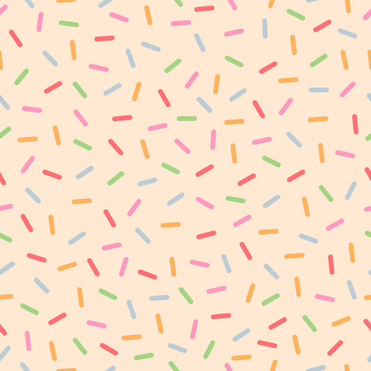 rainbow sprinkles, colorful sprinkles, pink background, peach background, multicolored, candy sprinkles, dessert pattern, fun pattern, whimsical design, bright colors, quilting cotton, fabric panel, cheerful mood, bakery theme, sweet treats, scattered pattern, playful design, orange sprinkles, blue sprinkles, green sprinkles