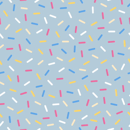 rainbow sprinkles, colorful sprinkles, blue background, pink sprinkles, yellow sprinkles, white sprinkles, orange sprinkles, scattered pattern, random placement, sweet treats, dessert theme, bakery motif, cheerful design, playful pattern, quilting cotton, fabric panel, confetti style, candy colors, fun design, whimsical sprinkles