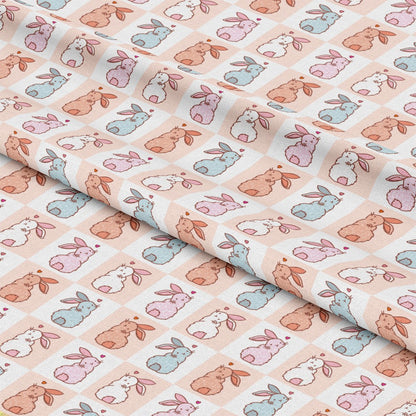 - Cute Easter Bunnies Checkered Pattern 1 Quilting Cotton Fabric - pastel colors - pink - blue - beige - brown - white - soft texture - small squares - bunny illustrations - quilting fabric - cotton material - sewing fabric - spring theme - delicate design - lightweight fabric